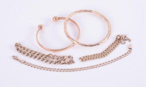 A mixed lot of 9ct yellow gold to include two bangles and three curb chain bracelets, total weight