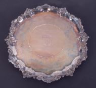 A Geo silver salver, London, marks are rubbed with shaped border, sword and shell crest engraved,