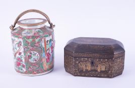 A Cantonese porcelain jar and cover, height 17cm together with a Chinese lacquered tea caddy.(2)