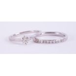A platinum ring set with a round brilliant cut diamond, approx. 0.35 carats, approx. colour J-K &