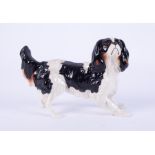 A Beswick King Charles spaniel dog, length 17cm.