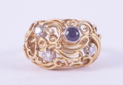 An ornate designed yellow & white gold ring (no hallmarks & not tested) set with a round cut