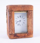 A French cased carriage clock, height including handle 15cm, with key.