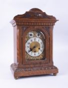 A Victorian carved wood mantle clock, three dial, strike movement with pendulum, height 46cm (