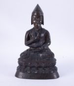 An Asian bronze seated figure, height 36cm.