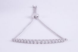 A 14ct white gold chain bracelet with a rigid centre section set with graduated sized round