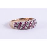 A 9ct yellow & white gold ring set with small round cut rubies and small round cut diamonds, 2.51gm,