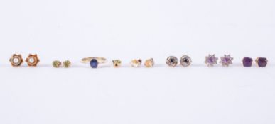 A mixed lot to include a 14k yellow gold ring set with an oval cut sapphire approx. 0.65 carats,