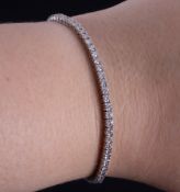 An 18ct white gold line bracelet set with approx. 3.50 carats of round brilliant cut