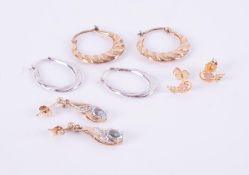 Four pairs of earrings to include a pair of 9ct white gold hoops, a pair of 9ct yellow gold hoops, a