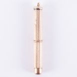 A 9ct yellow gold toothpick with an engineered finish, length 4.5cm (with pick retracted), 5.49gm.