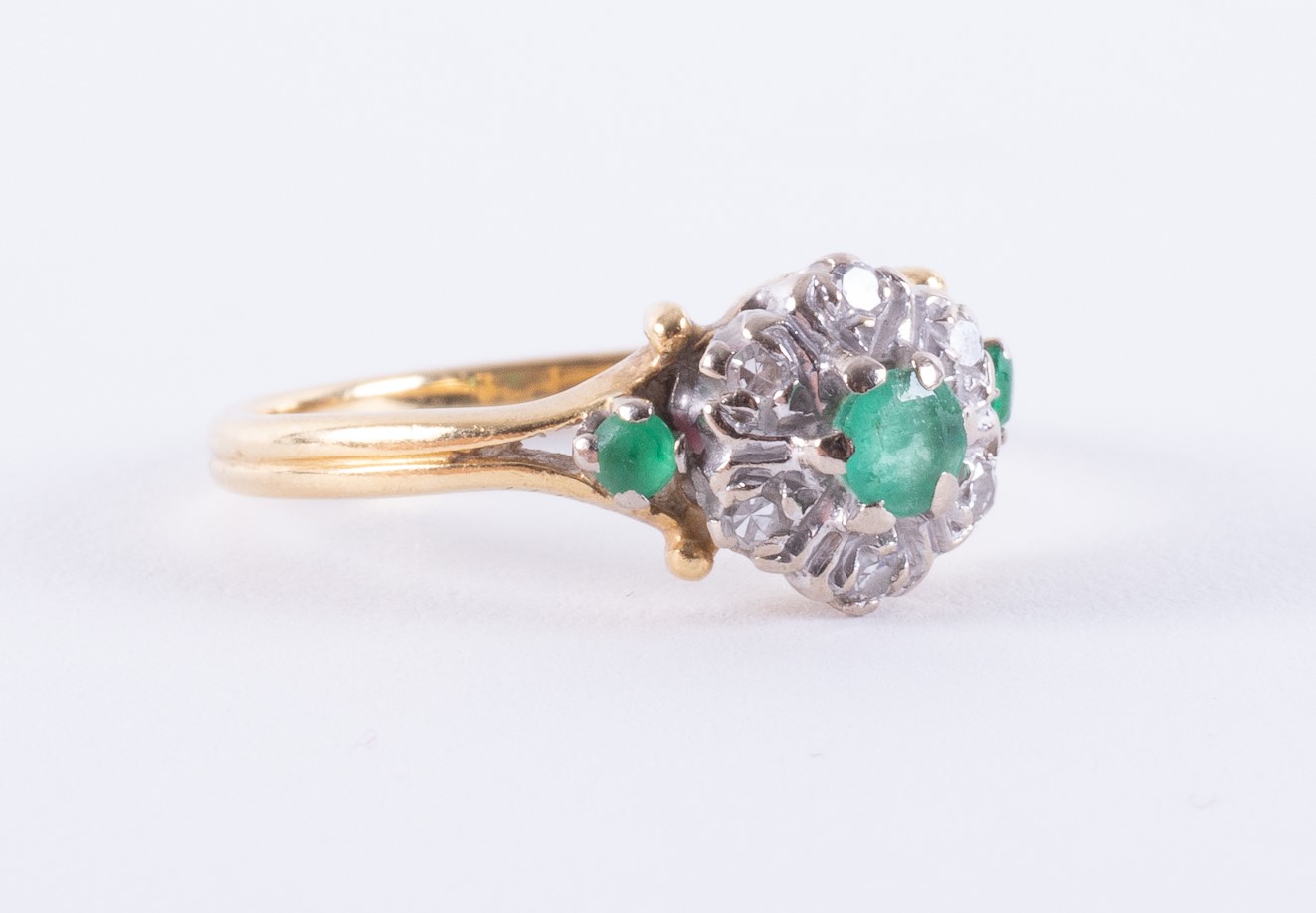 An 18ct yellow & white gold cluster design ring set with three round cut emeralds, approx. total - Image 2 of 2