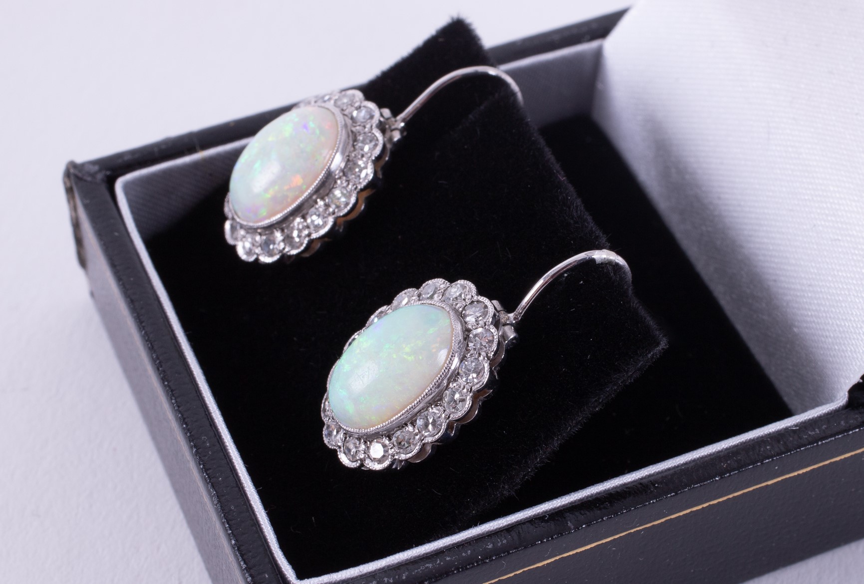 A pair of white gold cluster style drop earrings set with an oval cabochon cut opal, measuring - Image 2 of 2