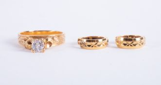 A 22k yellow gold ornate design ring set with a round brilliant cut diamond, approx. 0.36 carats,