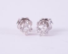 A pair of 18ct white gold four claw studs set with approx. 0.72 carats of diamonds total weight (0.