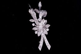 An fine flower spray brooch in white metal (not hallmarked or tested), stamped HC Ltd set with a