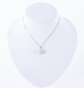 An 18ct white gold pear shaped pendant set with small round brilliant cut diamonds on a 18ct white