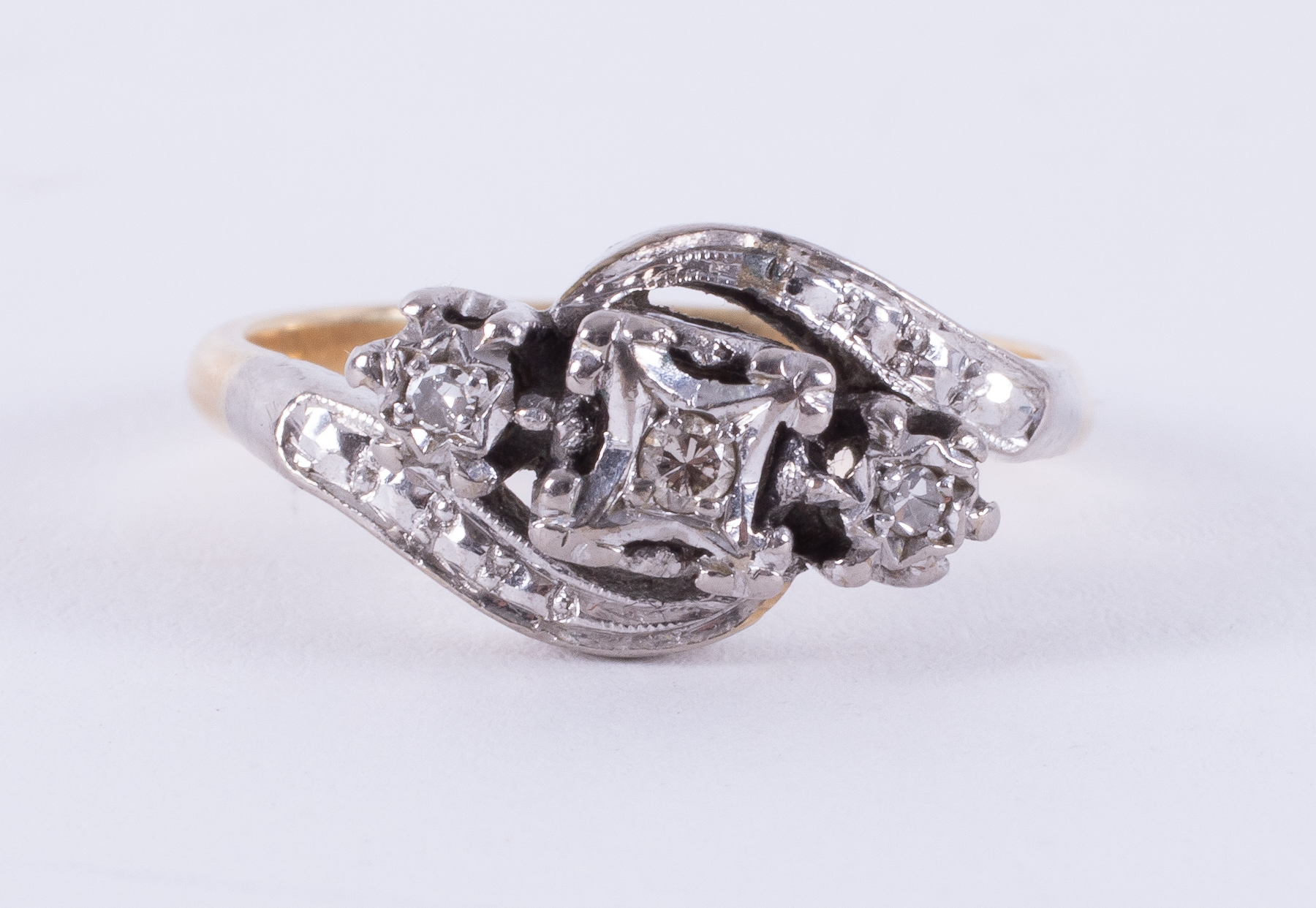 An 18ct yellow gold & platinum twist design ring set with three small round cut diamonds - Image 2 of 2