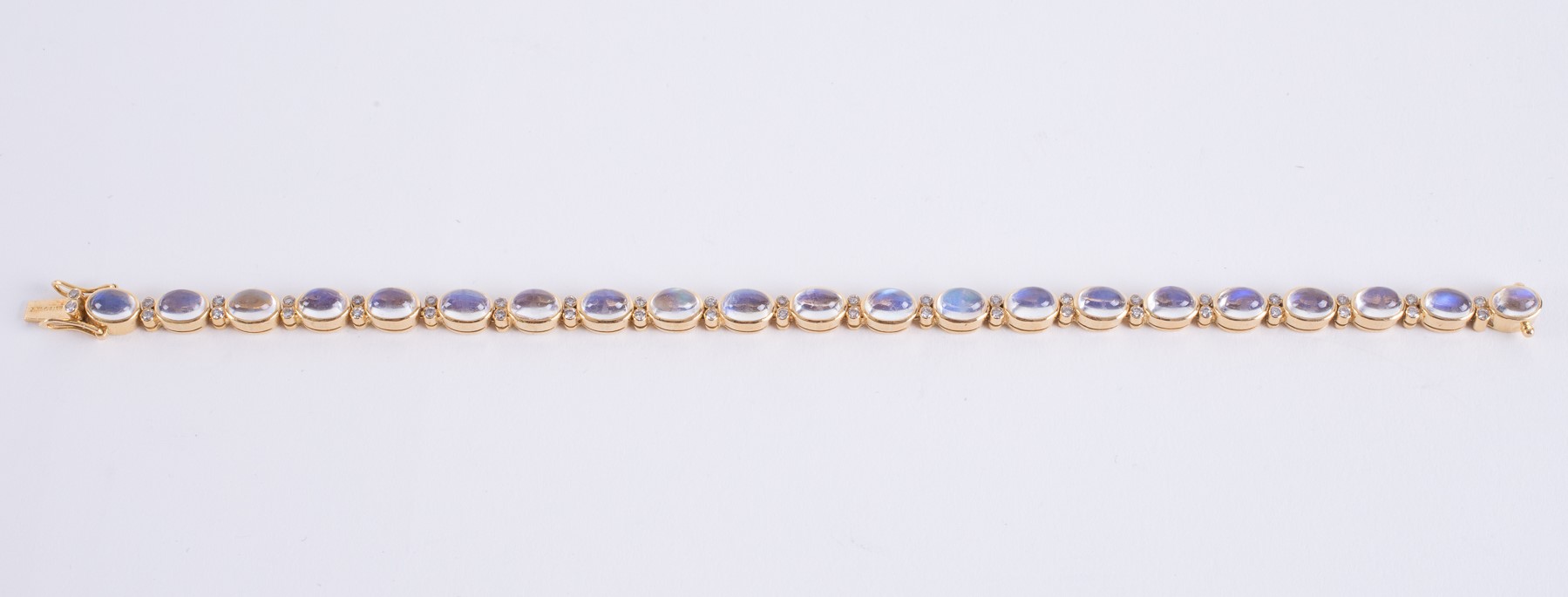 An 18ct yellow gold bracelet set with oval cabochon cut moonstones, measuring approx. 5.5mm x 4mm (