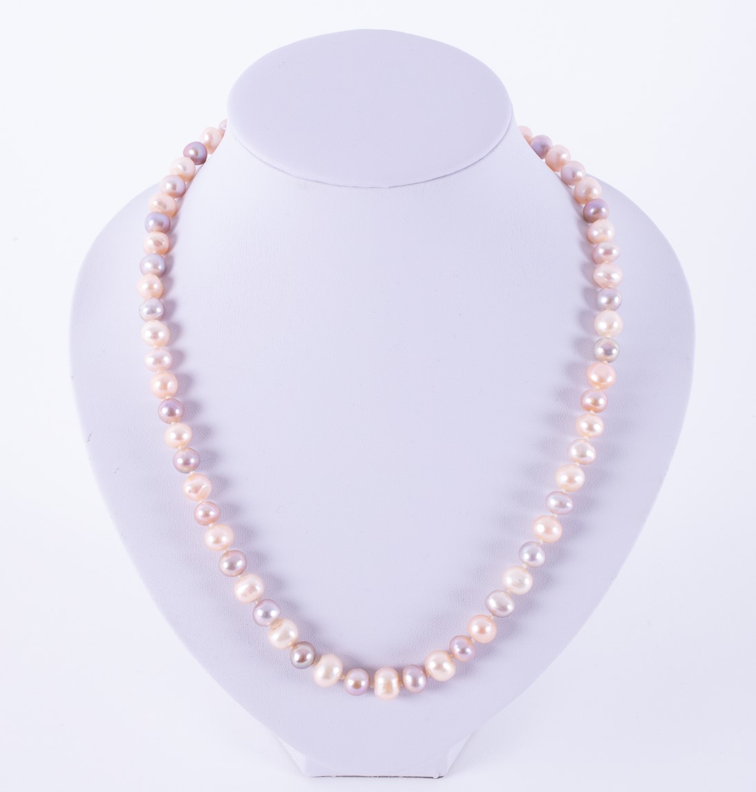 A 19" string of pastel coloured freshwater pearls set to an 18ct yellow gold brushed clasp, the