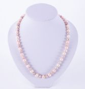 A 19" string of pastel coloured freshwater pearls set to an 18ct yellow gold brushed clasp, the