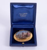 A 19th century ornate pinchbeck hand painted scenic brooch of Venice, view of the Arsenal