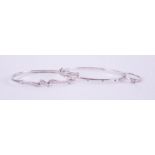 A mixed lot including a 9ct white gold bangle set with five small round cut diamonds, oval
