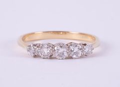 An 18ct yellow gold & platinum (no hallmarks & not tested) five stone ring set with old round