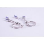 A pair of 9ct white gold drop earrings with a diamond set huggie type fitting and drops set with a