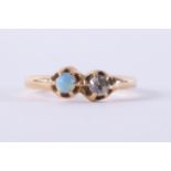 A yellow gold antique ring set with a cabochon cut opal measuring approx. 3.5mm and an old round cut