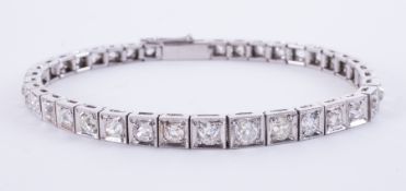 An impressive Art Deco platinum (not hallmarked or tested) graduated line bracelet set