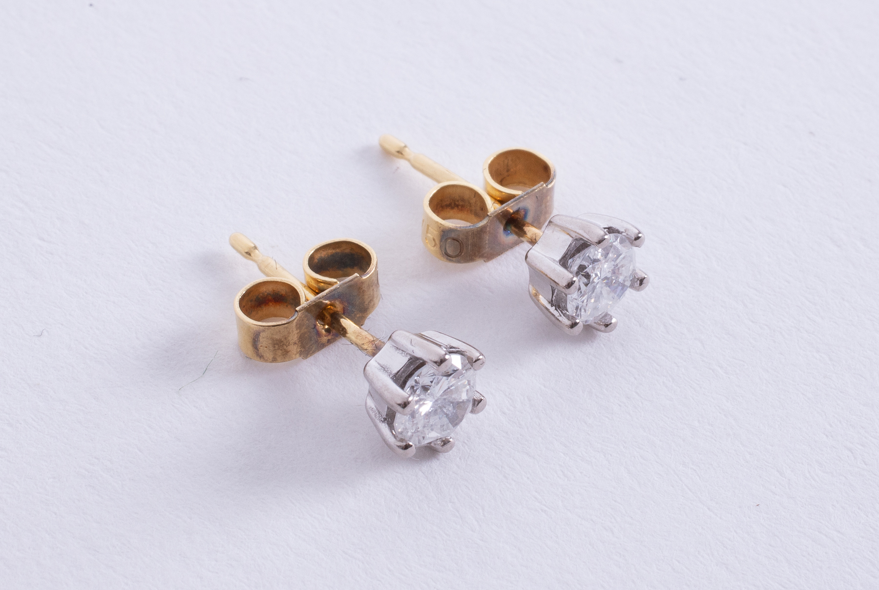 A pair of 18ct yellow & white gold studs set with round brilliant cut diamonds, total diamond weight - Image 2 of 2