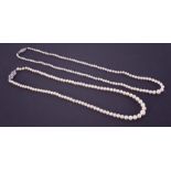Two strings of pearls to include a string of graduated cream cultured pearls ranging from 3.5mm to