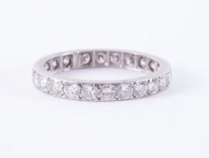 A white metal (not hallmarked or tested) full eternity ring set with older round brilliant cut