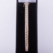 An impressive yellow gold bangle set with approx. 7.50 carats of round brilliant cut diamonds,