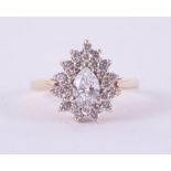 A 14ct yellow & white gold pear shaped cluster ring set with a central pear shaped diamond,