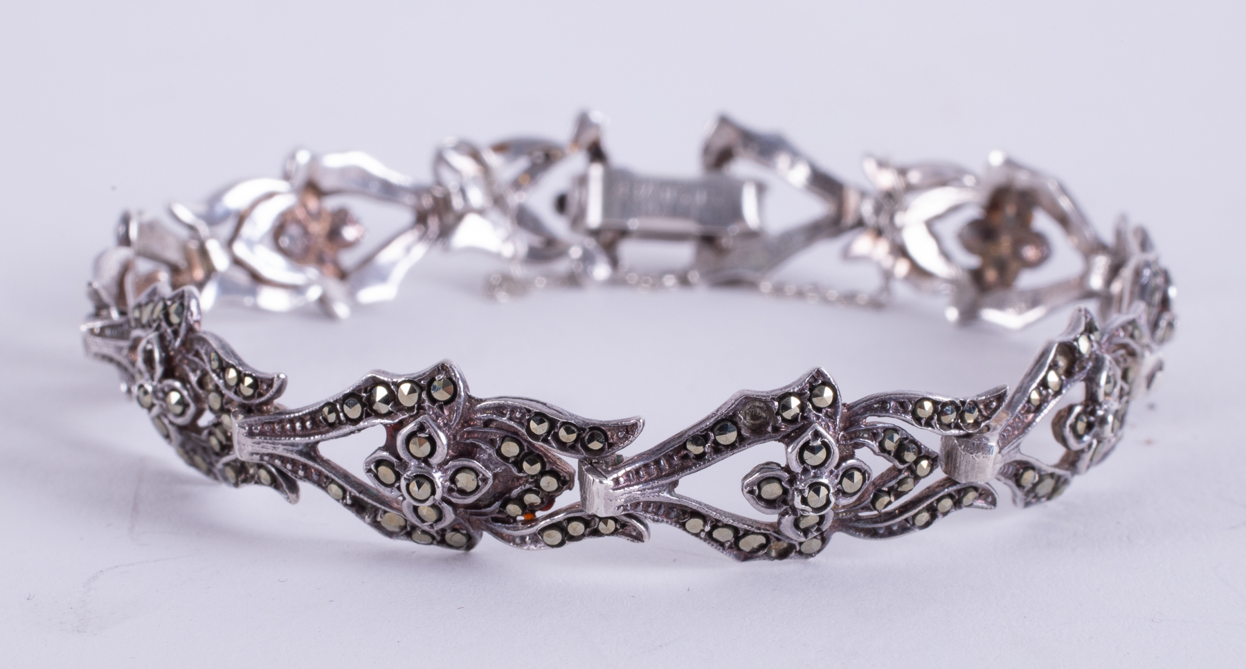 A mixed lot of three jewellery items to include an ornate silver bracelet set with marcasite, - Image 2 of 2