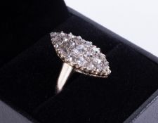 An antique marquise shaped ring in yellow & white gold (not hallmarked or tested) set with old round