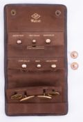 A set of yellow gold dress studs & cufflinks in a brown leather wallet, the six dress studs