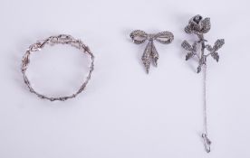 A mixed lot of three jewellery items to include an ornate silver bracelet set with marcasite,