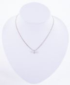 An 18ct white gold handmade pendant (not hallmarked or tested) set with a round brilliant