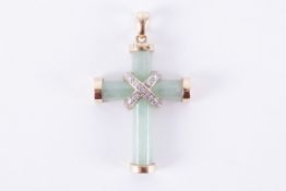 A 9ct yellow gold jade cross with a white gold central crossover design set round cut diamonds in an