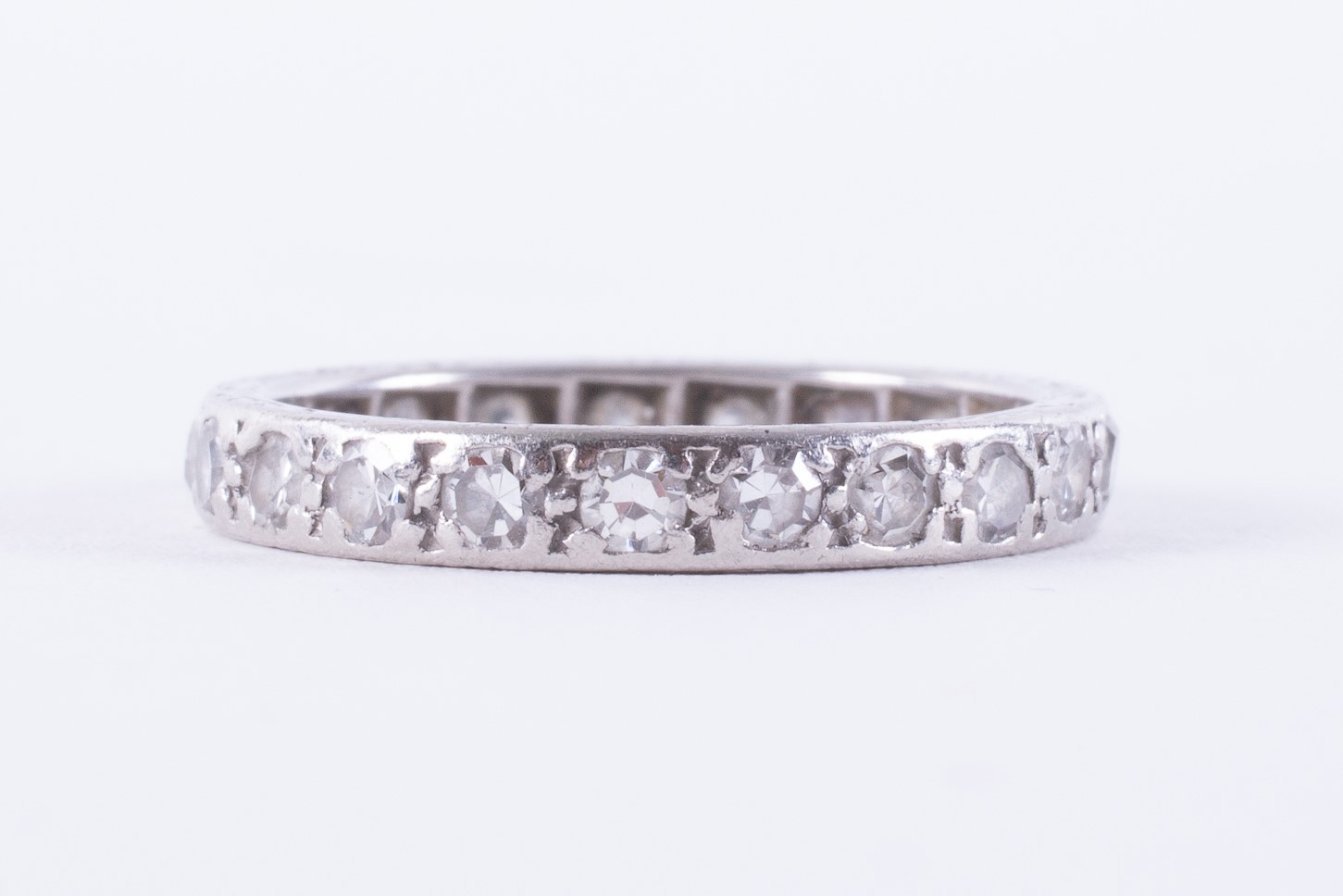 A platinum full eternity ring (not hallmarked or tested) set with round single cut diamonds, approx.