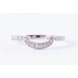 An 18ct white gold shaped band set half way around with small round brilliant cut diamonds,