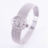 Longines, a ladies vintage 9ct white gold Longines wristwatch, with oval face and textured design