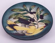 A Moorcroft limited edition circular plate, Golden Oriole bird and fruiting vine, No 157/750,