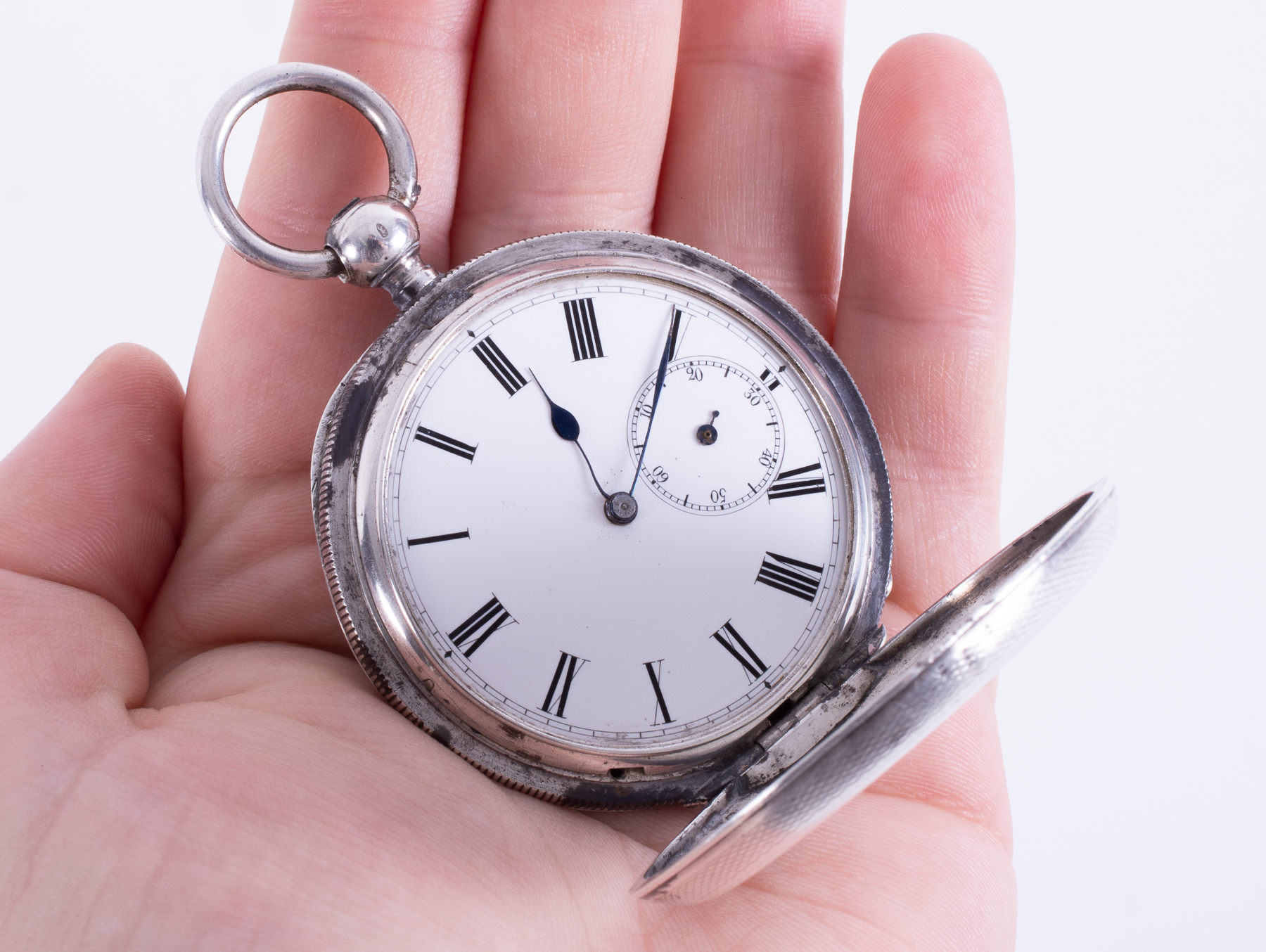 A silver open face pocket watch by J.W.Benson, sub second hand broken, with watch stand. - Image 2 of 3