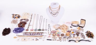 A large selection of costume jewellery & silver, to include chains, beads, brooches, charm bracelet,