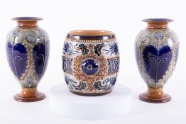 A pair of Royal Doulton Lambeth vases, height 19cm together with a Royal Doulton Lambeth jar (3).