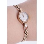 Longines, a 9ct yellow gold ladies vintage Longines wristwatch with a 9ct yellow gold bracelet,